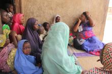 Community Health Champion demonstrates symptoms of meningitis to the audience_Photocredit-WHO_CE.Onuekwe