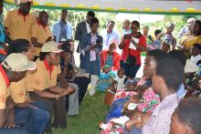 Minister of Health and Minister of Gender and Family Promotion discussing with young mothers