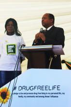 Honorable Minister of Health and Child Care Dr O. Moyo standing with Norleen Tembo, a recovered drug user who gave a testimony