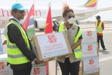 WFP Rep. Madame Wanja handing donated materials to the WHO Representative, Dr. Desta A. Tiruneh for onward Transmission to the Hon. Minister for Health